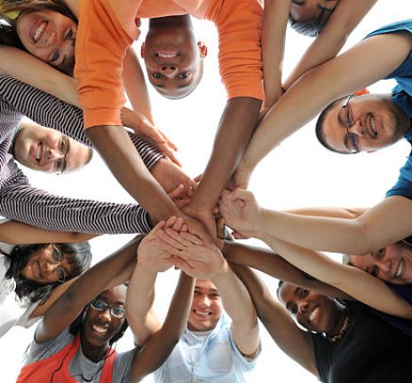 non-proft-youth-organization Ten diverse, African American, Asian, caucasian, East Indian, young adults illustrating teamwork.